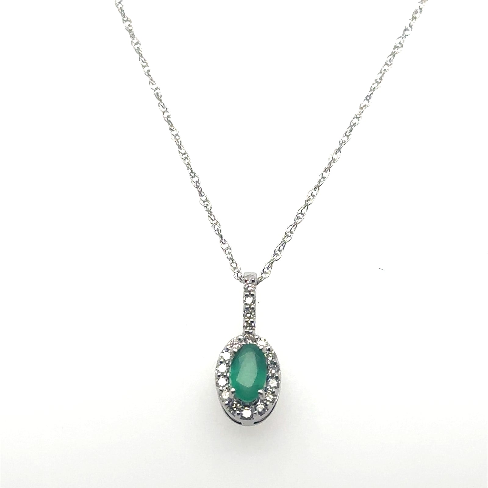 10K White Gold Oval Emerald Pendant With Diamond Halo