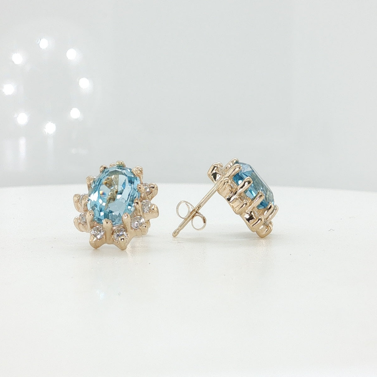 14K Yellow Gold Oval Blue Topaz and Diamond Studs